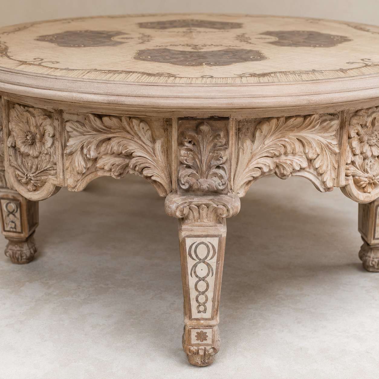Handcrafted carved pale wood coffee table